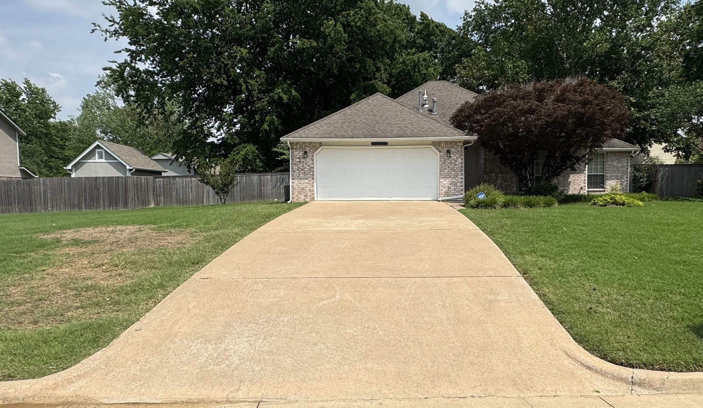 Sparkling Tulsa Driveways: Bravo Pressure Washing’s Surface Cleaner Before & After Photos